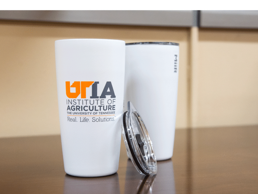White tumbler with UTIA logo